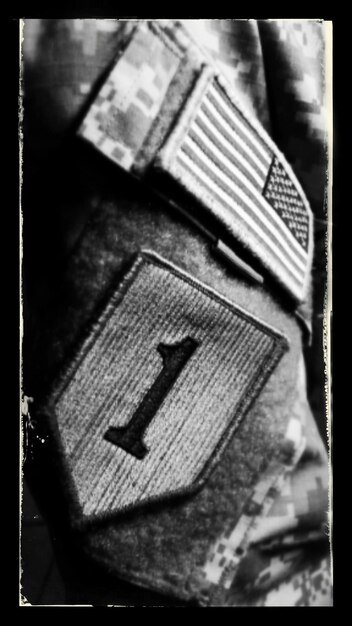 A grainy, black-and-white photograph of alleged leaked documents with redacted text, suggesting hidden information and government secrecy related to unidentified aerial phenomena.